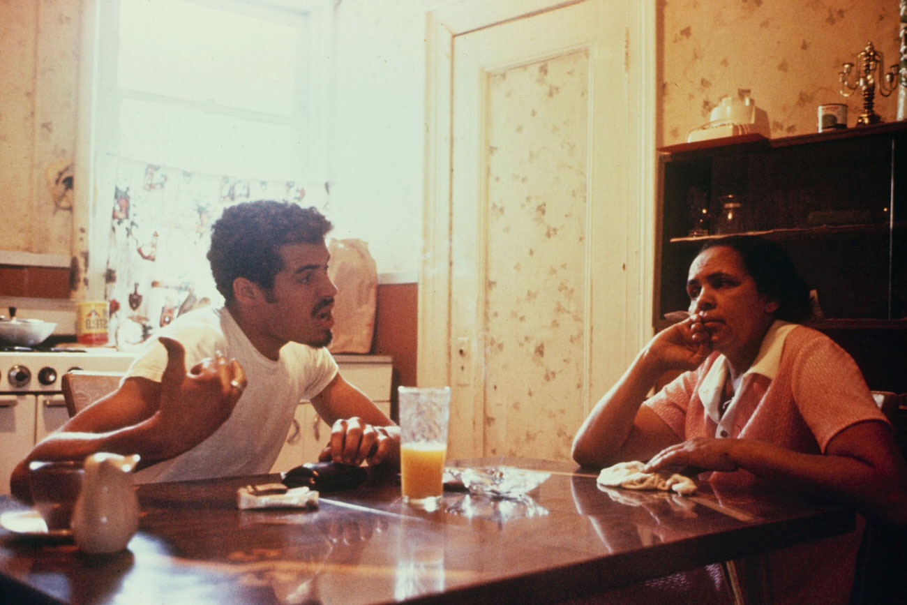 Reapers president Eddie Cuevas and his mother in their South Bronx apartment, 1972.