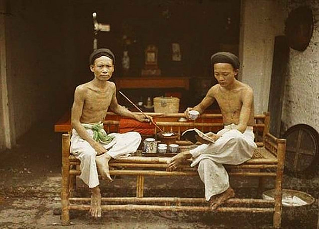 Tonkin - Hanoi: Two opium smokers drinking tea, 1915