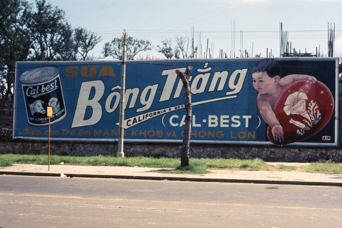 A Cal-Best sign across the street from the American Embassy in Saigon, 1968.