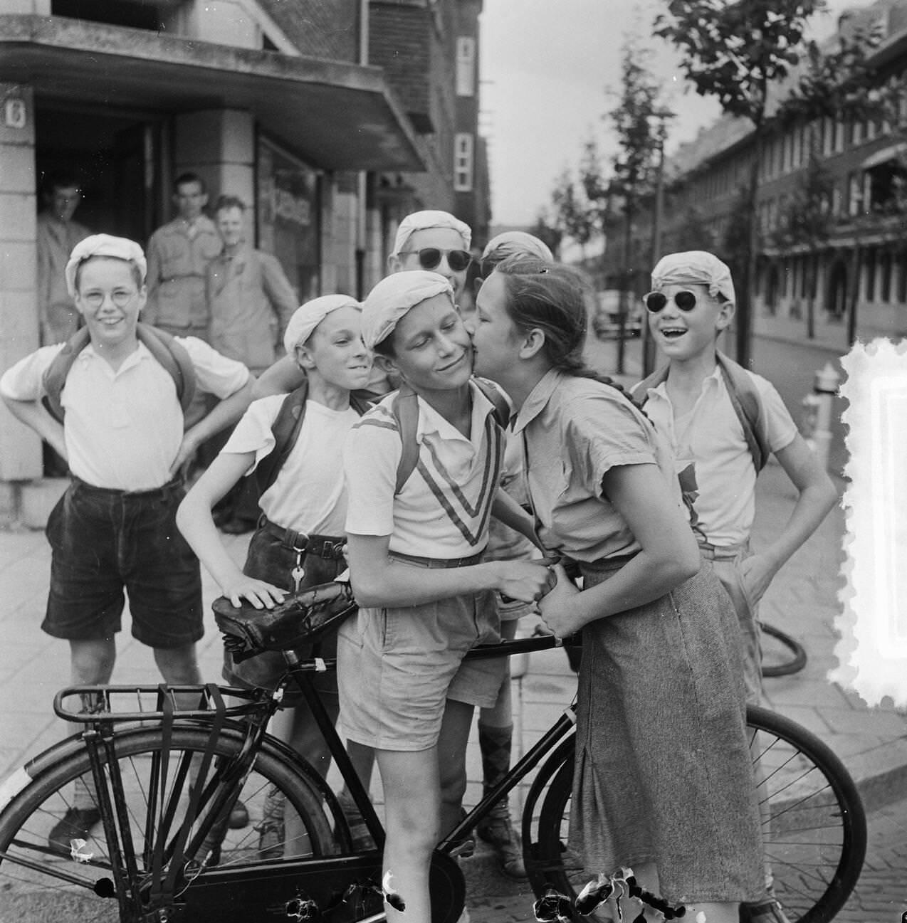 Boys participating in the Tour de France, 1953.