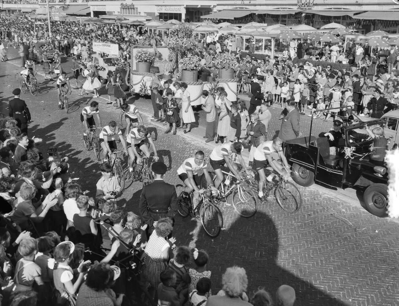 A Tour de France team on a bicycle, 1950s.