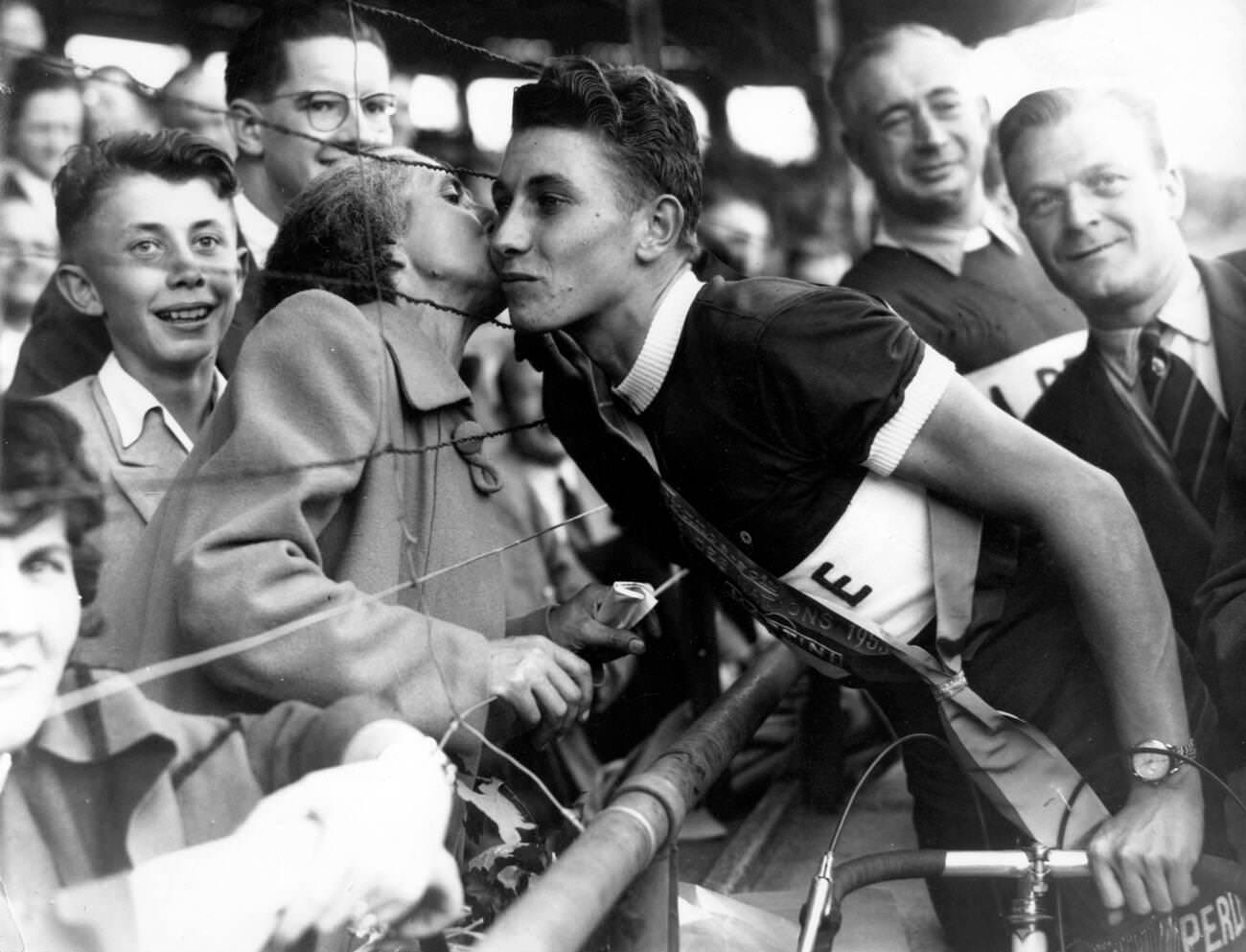 Jacques Anquetil being kissed by his mother after winning the Grand Prix Des Nations, 1953.