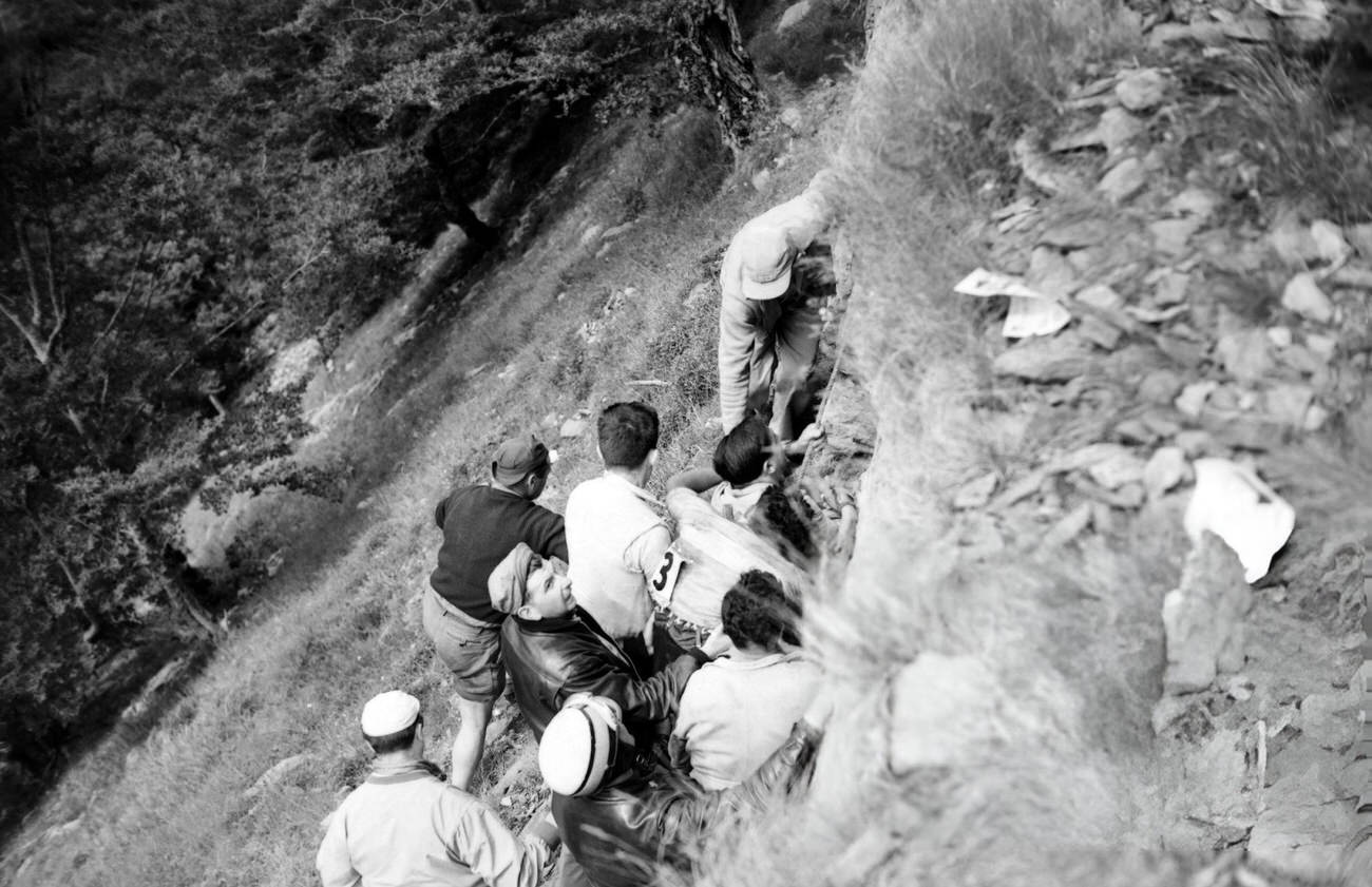 Cyclist Guy Buchaille rescued after his fall during the Tour de France, 1953.