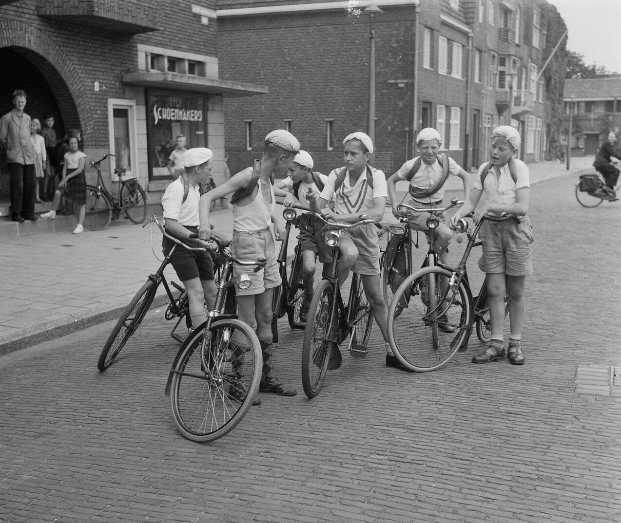 Boys deliberating the start of the Tour de France, 1953.