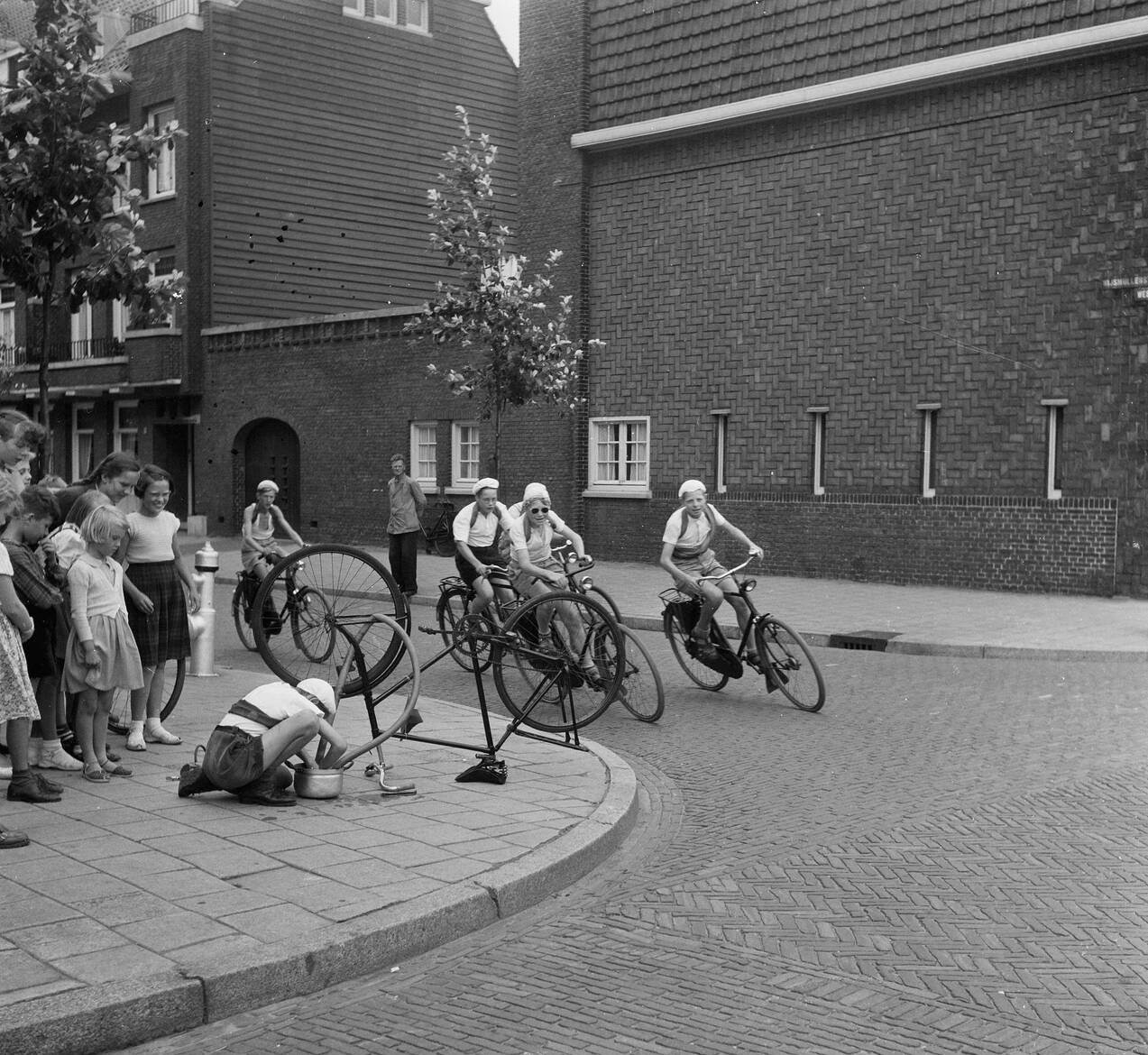 Boys during a stage of the Tour de France, 1953.