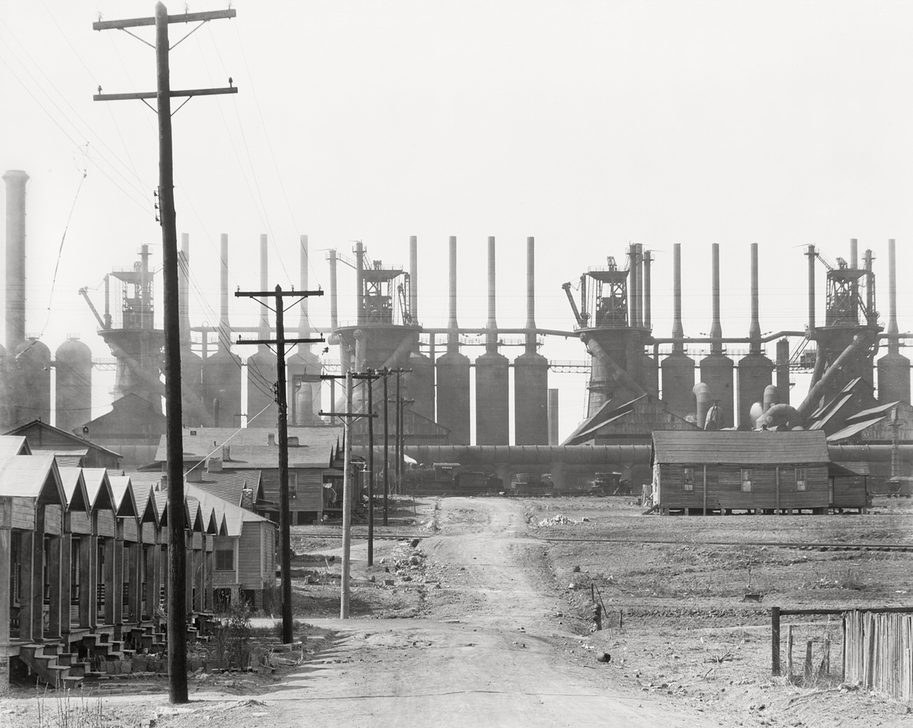 A Birmingham steel mill and workers' house, 1936.