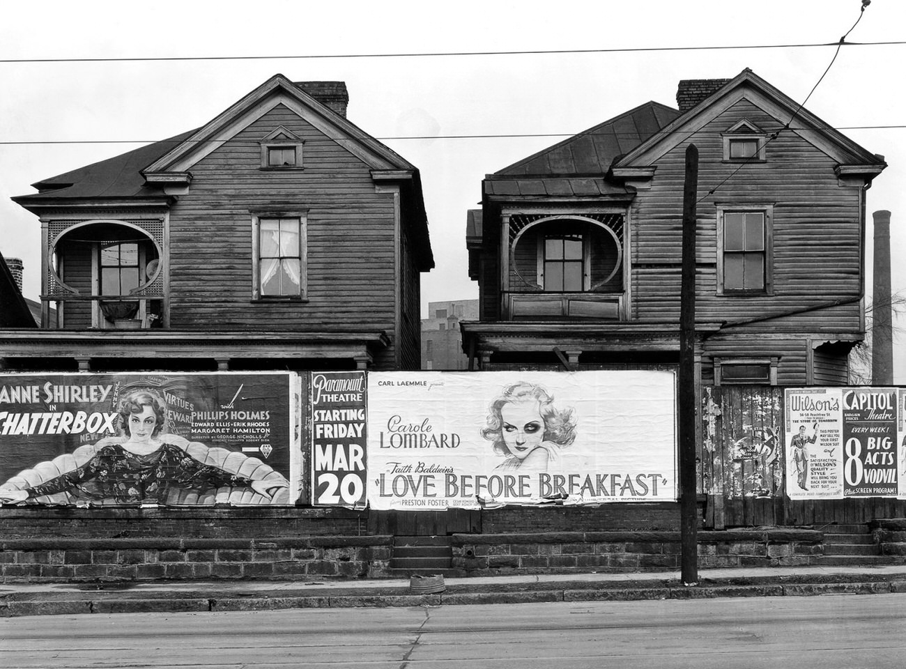 Frame houses and a billboard in Atlanta, Georgia, 1936.