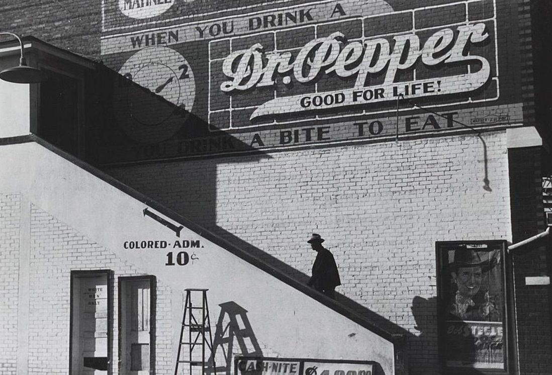 A man ascending the "colored" entrance of a movie house in Belzoni, Mississippi, 1939.