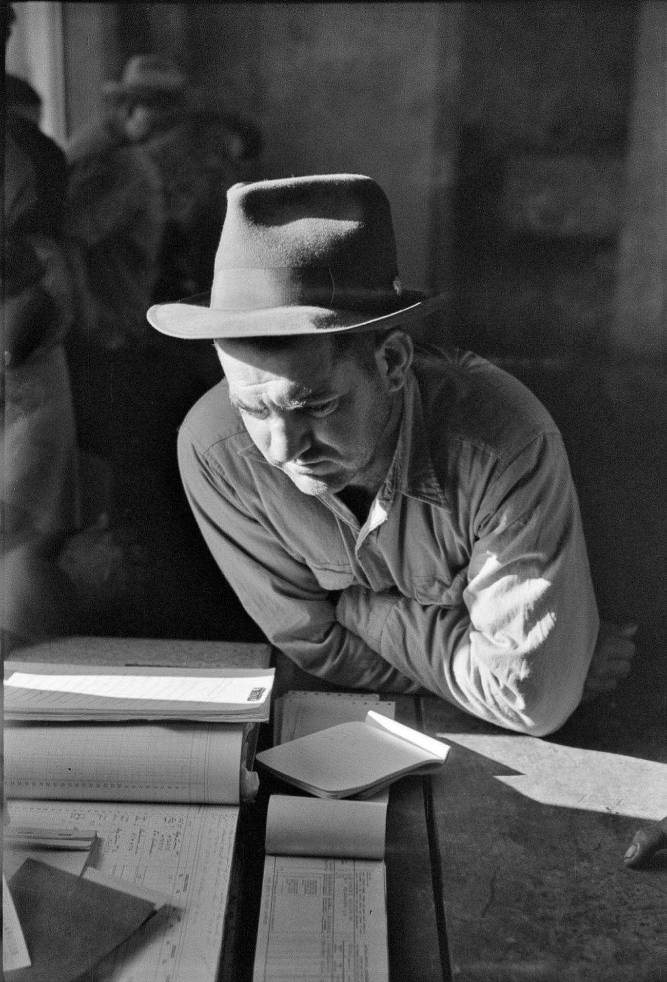 A fur buyer from New Orleans at a muskrat auction on Delacroix Island, Louisiana, 1941.