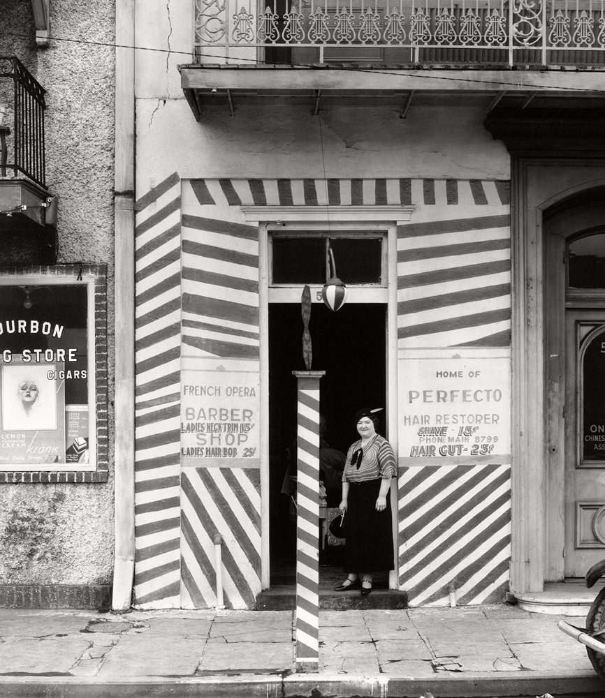 A sidewalk and shopfront in New Orleans, 1935.