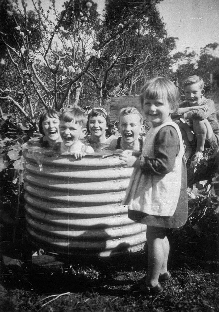 Cousins enjoying a pool at Mount Kuring-gai, NSW.