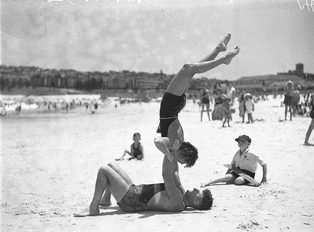 Mr. J. Prentice and Miss J. Howat performing beach acrobatics at Bondi Beach, January 1935.