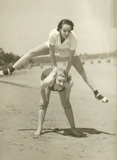 Valerie Hays from the cast of 'Over She Goes' being leapfrogged, 1937.