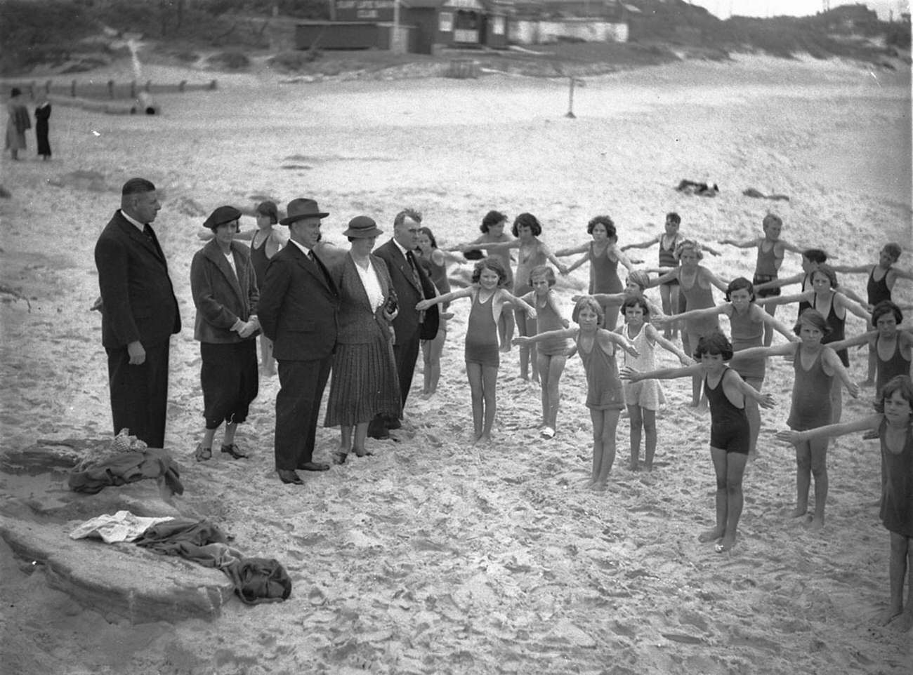 Inspectors of Schools and Swimming watching Stewart House swimming exercises at South Curl Curl, January 1935.