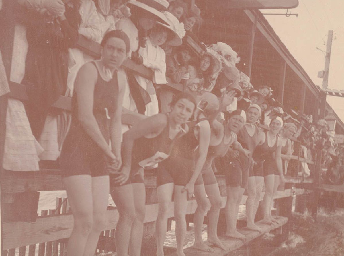 Start of a girl's swimming race, Mina Wylie with raised hand.