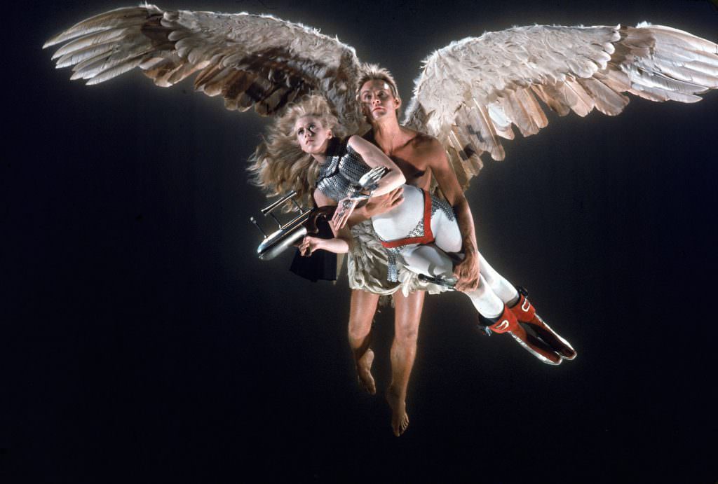 Guardian Angel (John Phillip) carried off Barbarella.