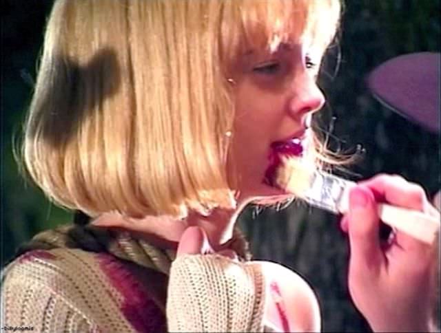 Drew Barrymore gets bloodied up during the filming of “Scream”