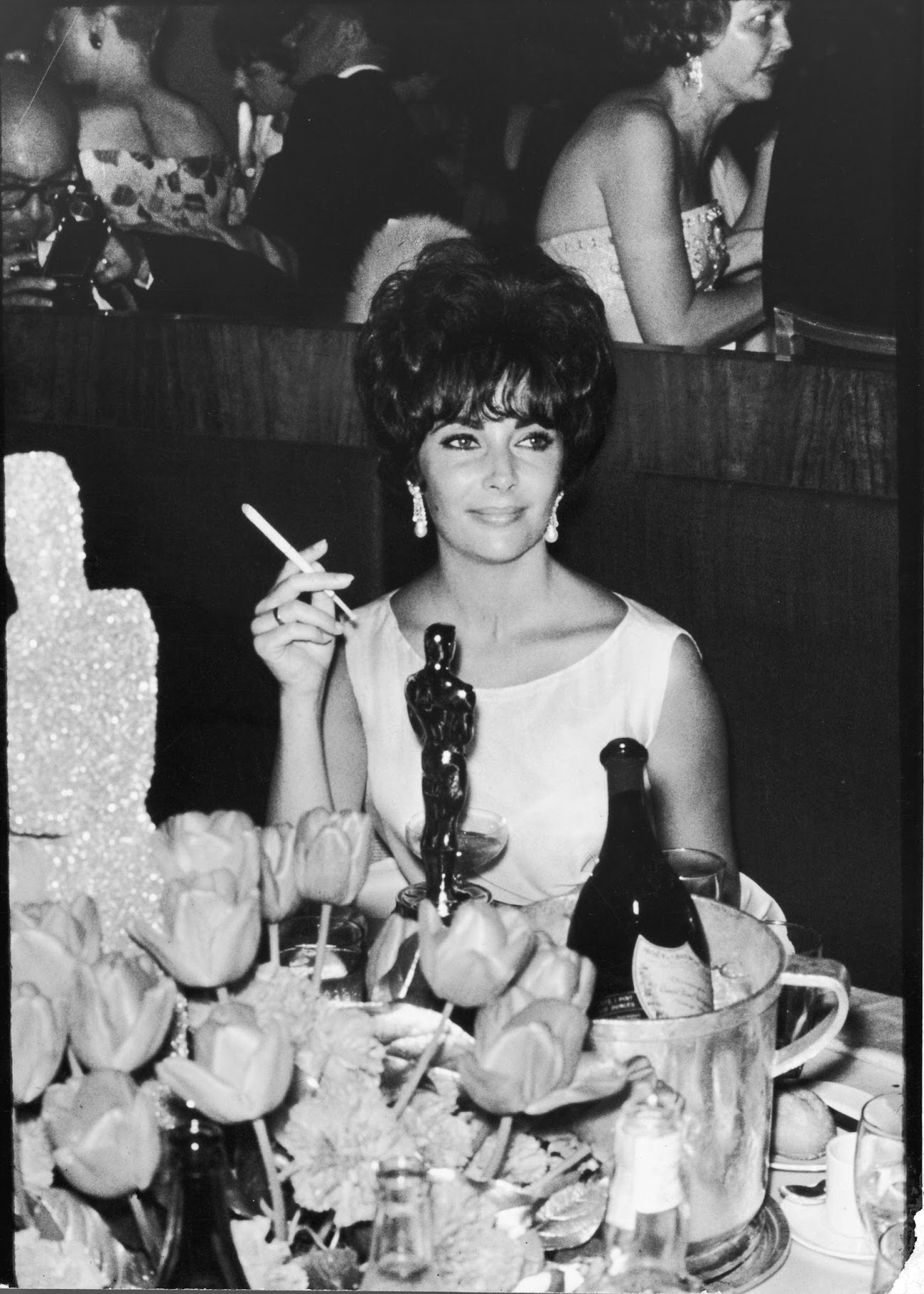 Elizabeth Taylor at a party after winning the Oscar for her performance in BUtterfield 8, 1961.