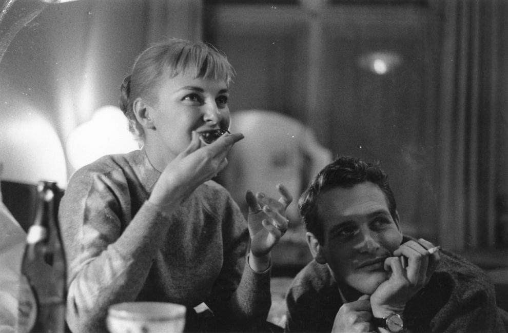 Joanne Woodward eating someth...sorry, too distracted by Paul Newman's face, 1958