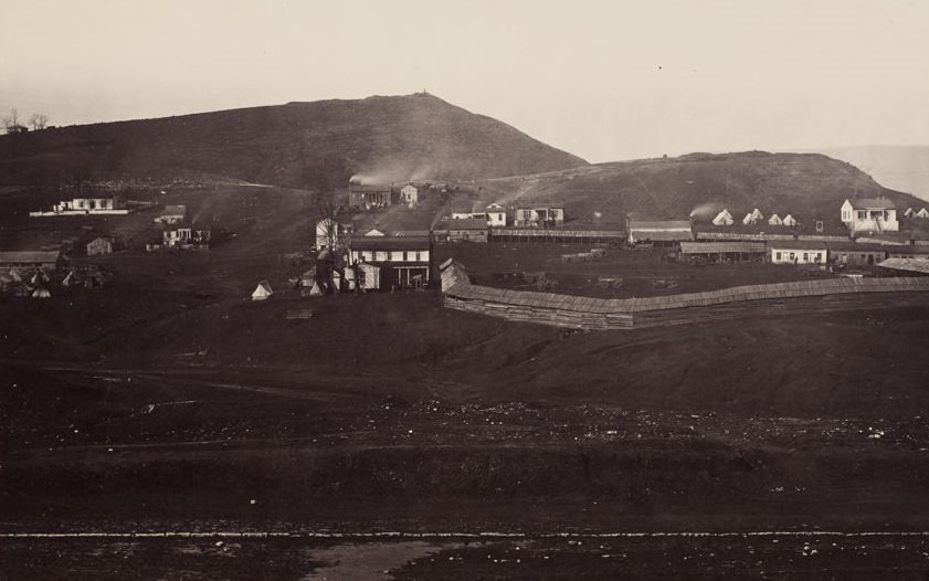 View of common hall with quartermasters' stables in the foreground at Chattanooga, 1865