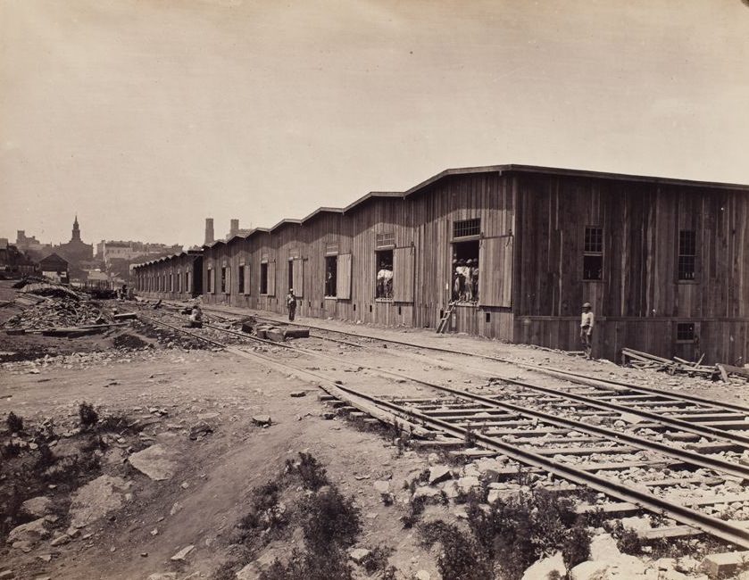 Warehouses in a railroad yard, 1865