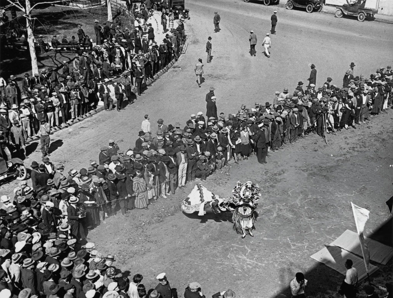 Crowds watching the ancient lion dance during Chinese New Year celebrations in Los Angeles' Chinatown, 1926.