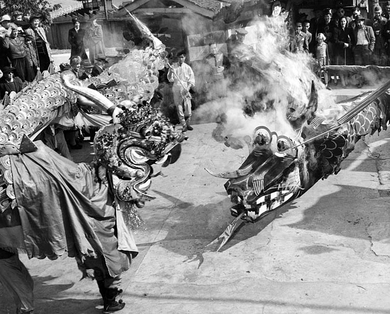 The black and golden dragons fight during New Year's celebrations in Los Angeles' Chinatown, 1942.