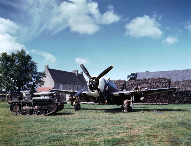 Maintenance work on an American P-47 Thunderbolt in a makeshift airfield in the French countryside, summer 1944