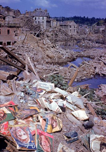 Magazines scattered among the rubble of the heavily bombed town of Saint-Lô, Normandy, France, summer 1944