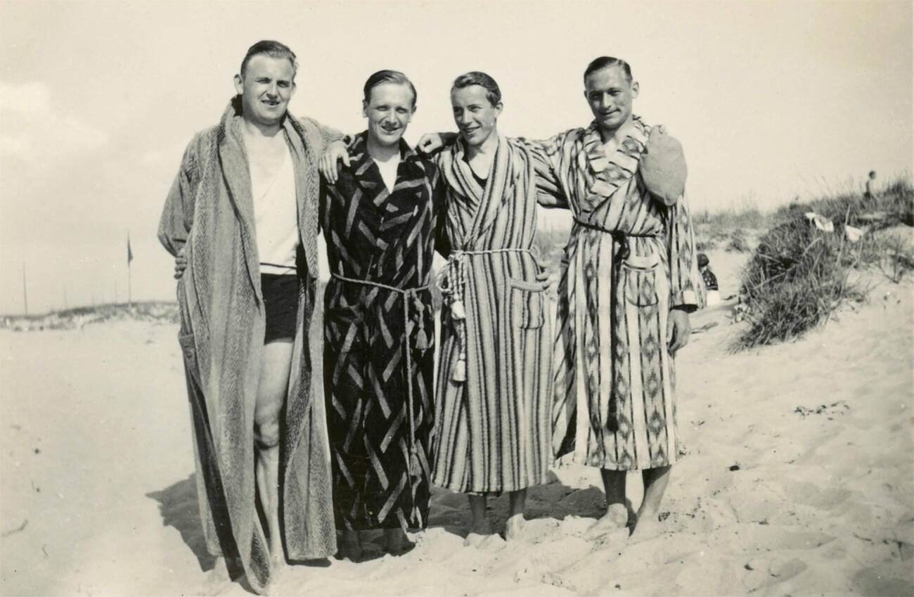 Friends on the beach in bathrobes, Denmark