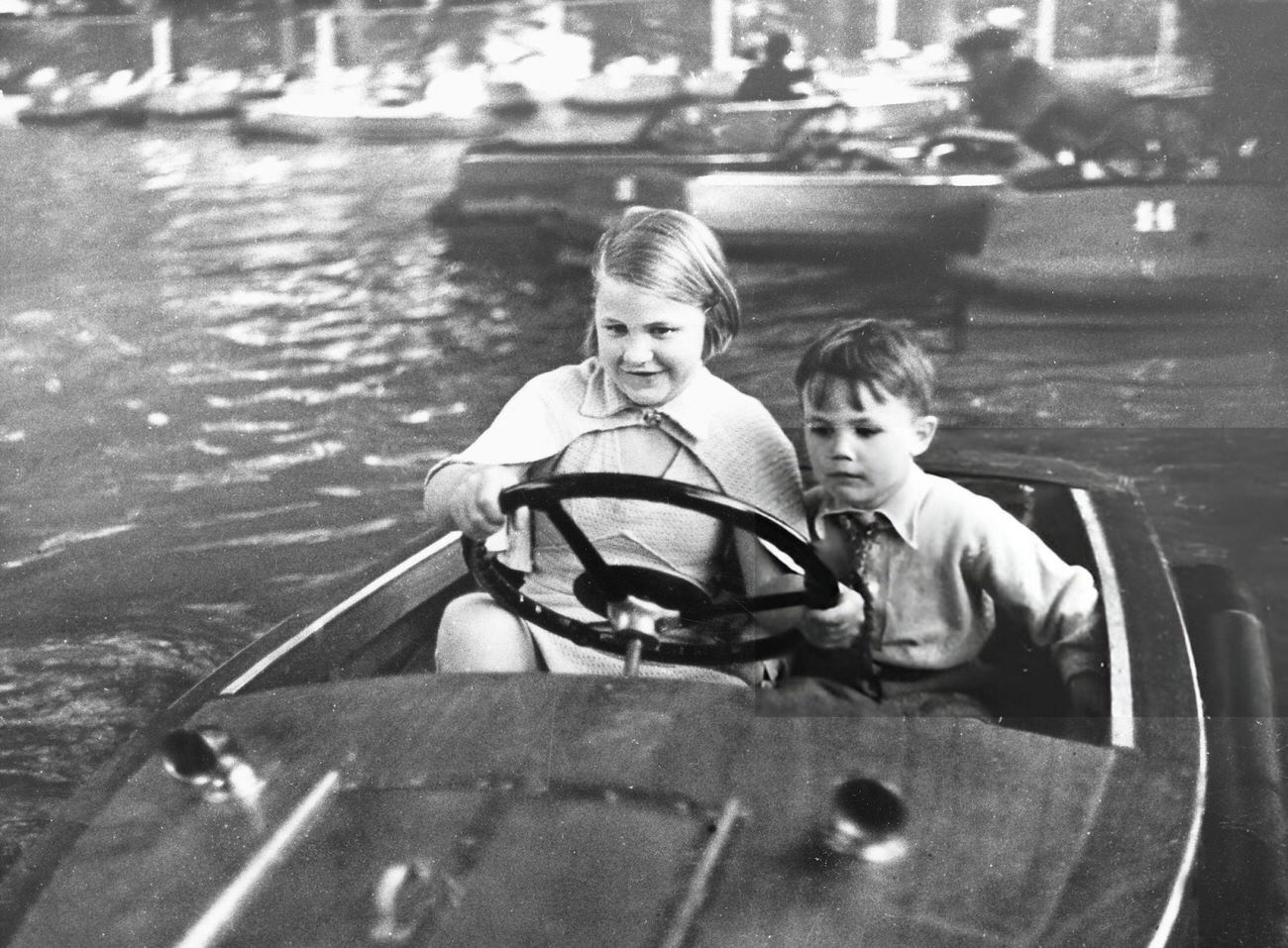 Children riding a boat in Tivoli Gardens, Copenhagen, 1934