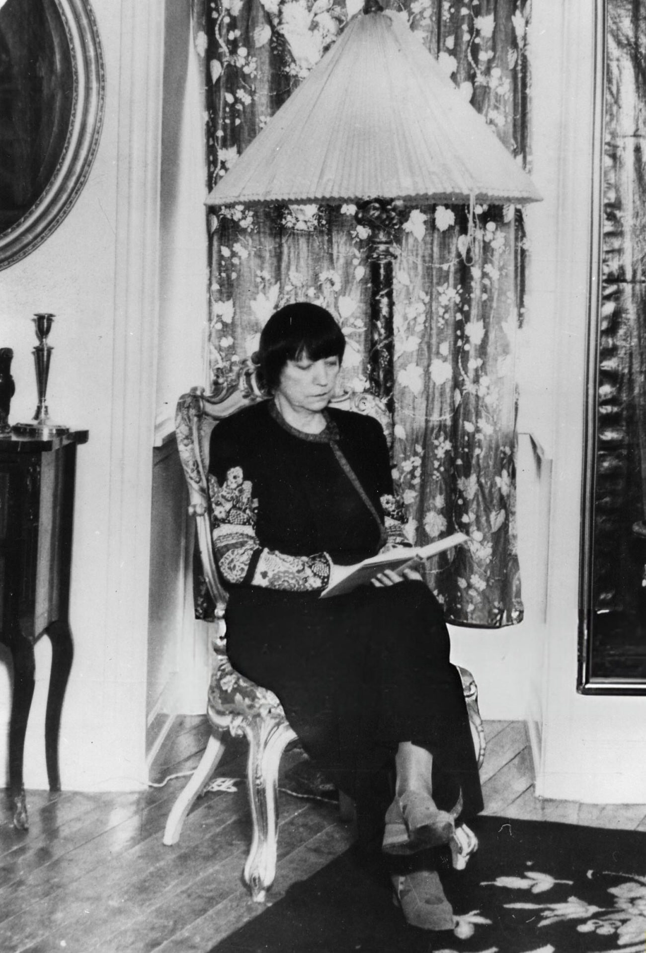 Asta Nielsen reading in her apartment, Denmark