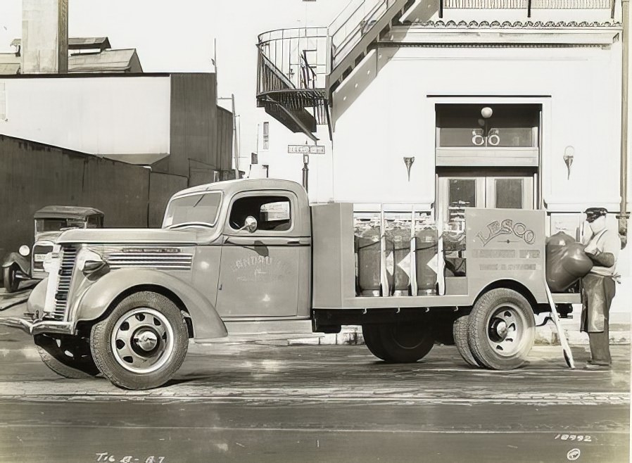 Model T 16 B - A 7 Man loading carbonated water tanks.