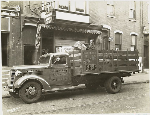 Model T 16 B - A 7 Man loading beer bottles.