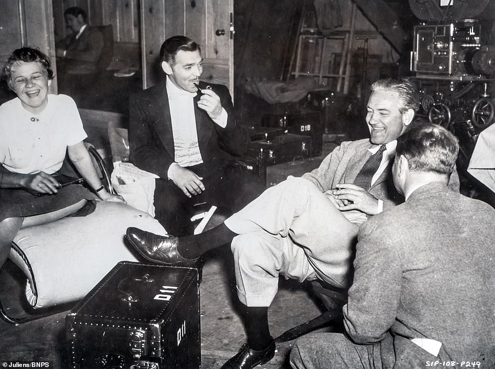 Clark Gable and director Victor Fleming share a joke on set.