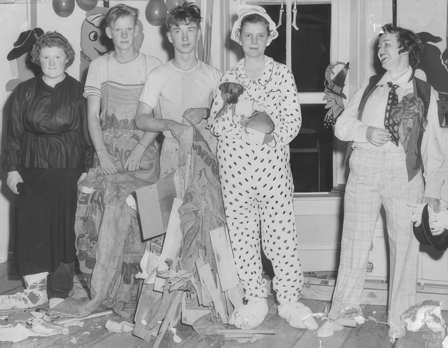 Teens dressed up with friends, 1958