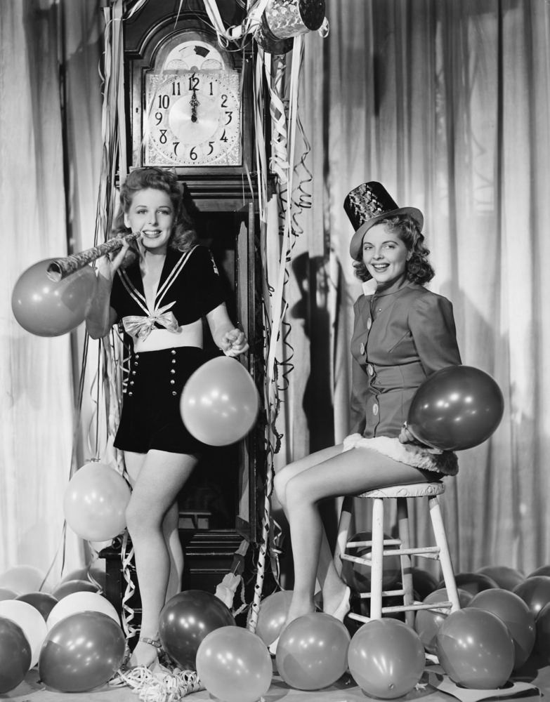 Women with balloons on New Years Eve.