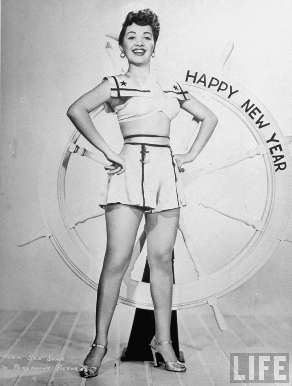 Olga San Juan posing for publicity still with nautical theme bearing message: HAPPY NEW YEAR, 1944.