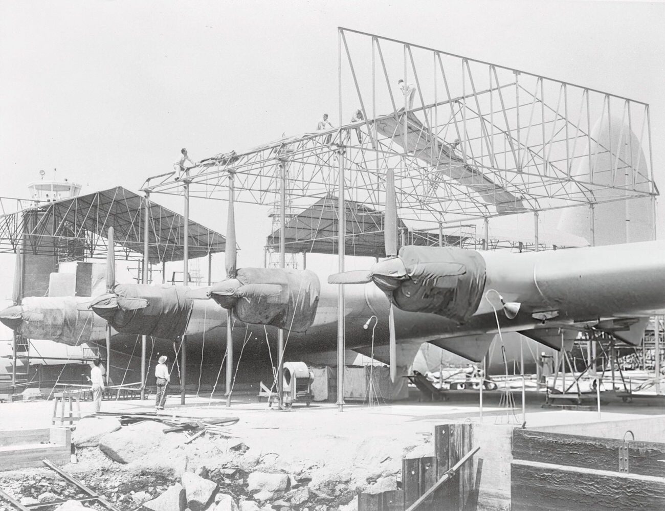 Workmen making covers for Howard Hughes' Spruce Goose, 1940s.