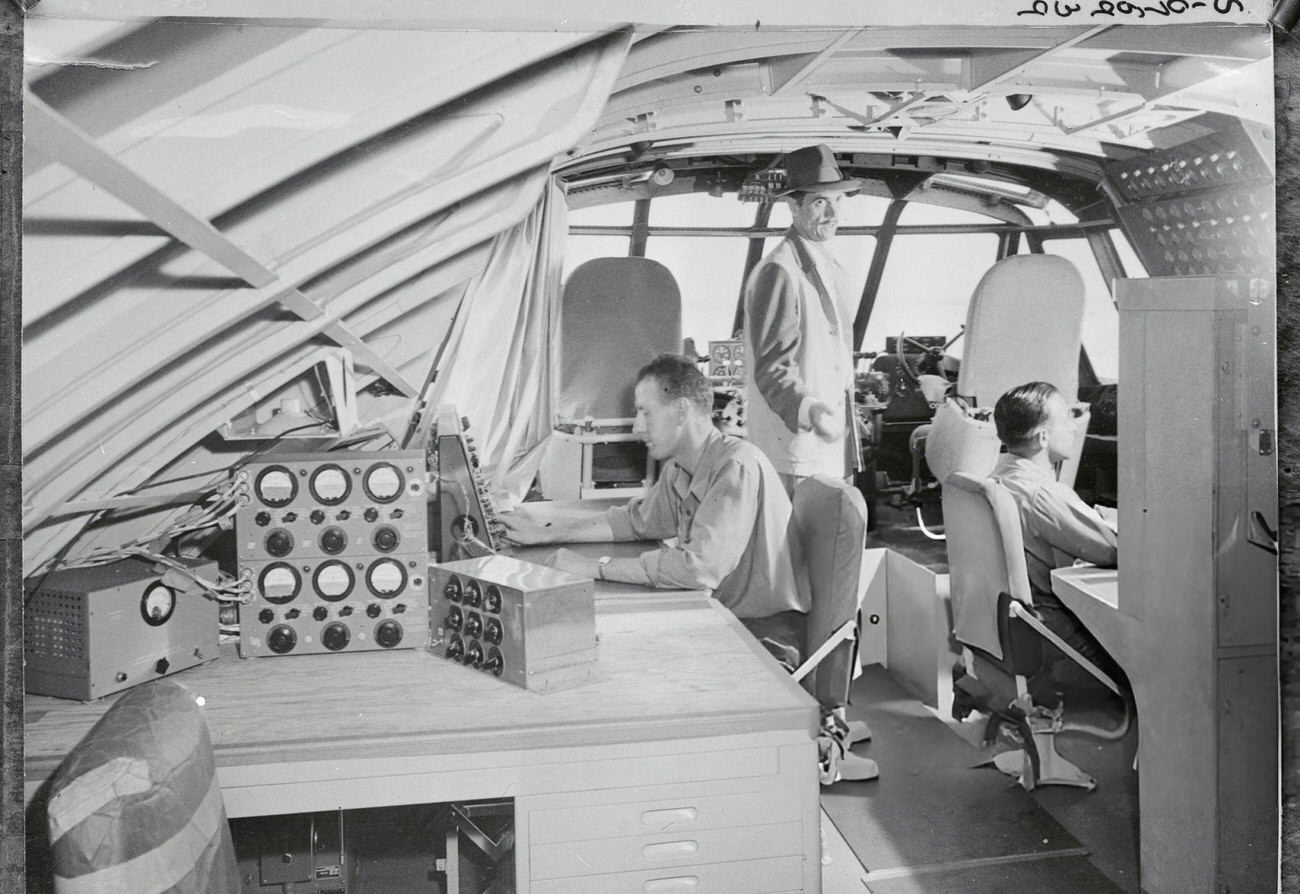 Howard Hughes with crew on the flight deck of the Spruce Goose, 1947.