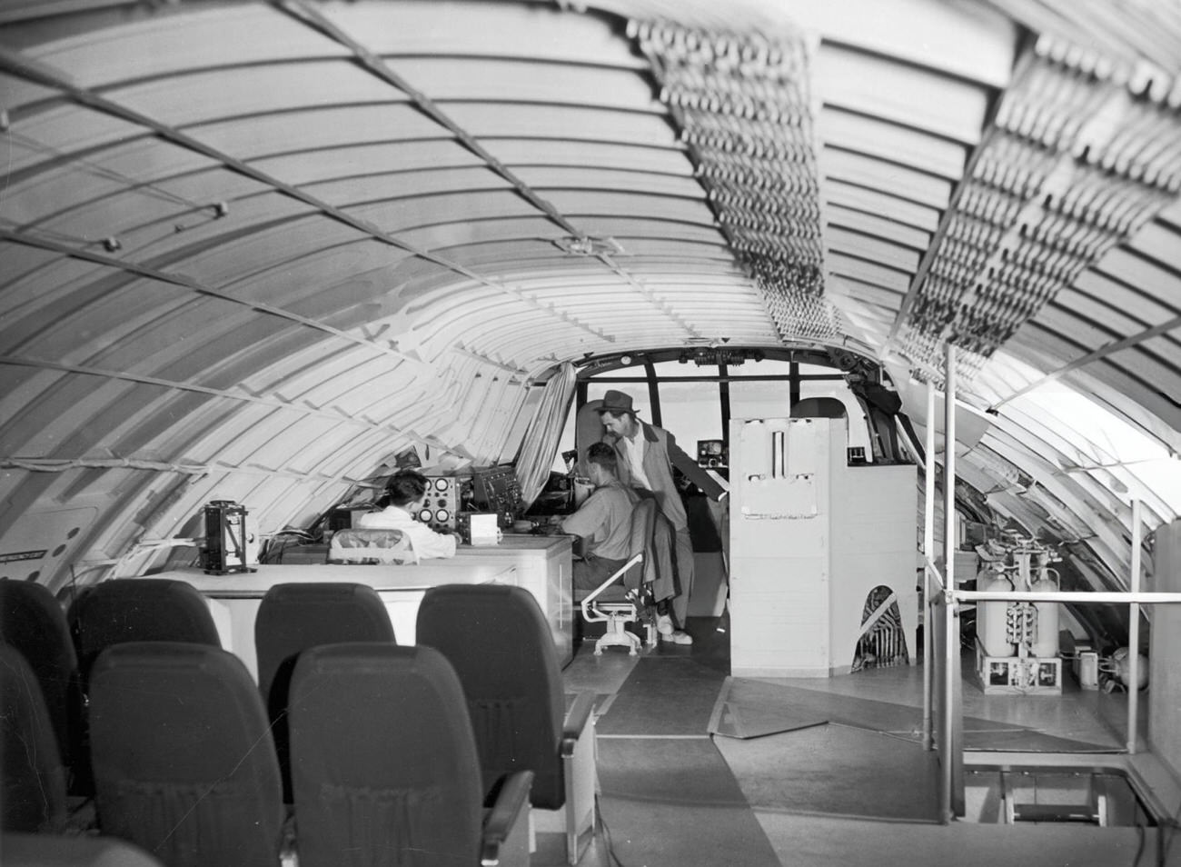 Howard Hughes talking to staff on the Spruce Goose on the day of its only flight, 1947.