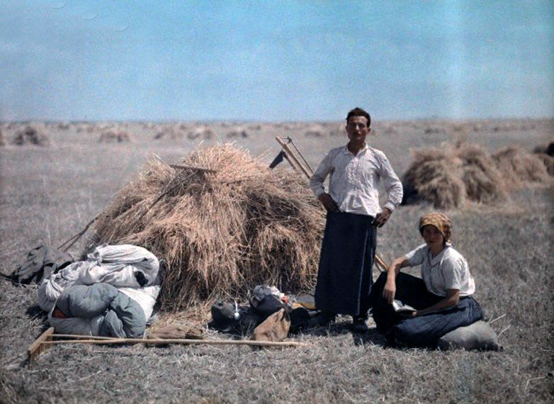 A peasant couple works during harvest in Hungary, January 1930.