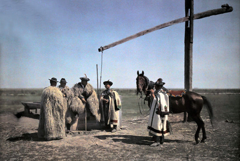 Cowboys, a horse, and a well on the Hungarian puszta, 1932.