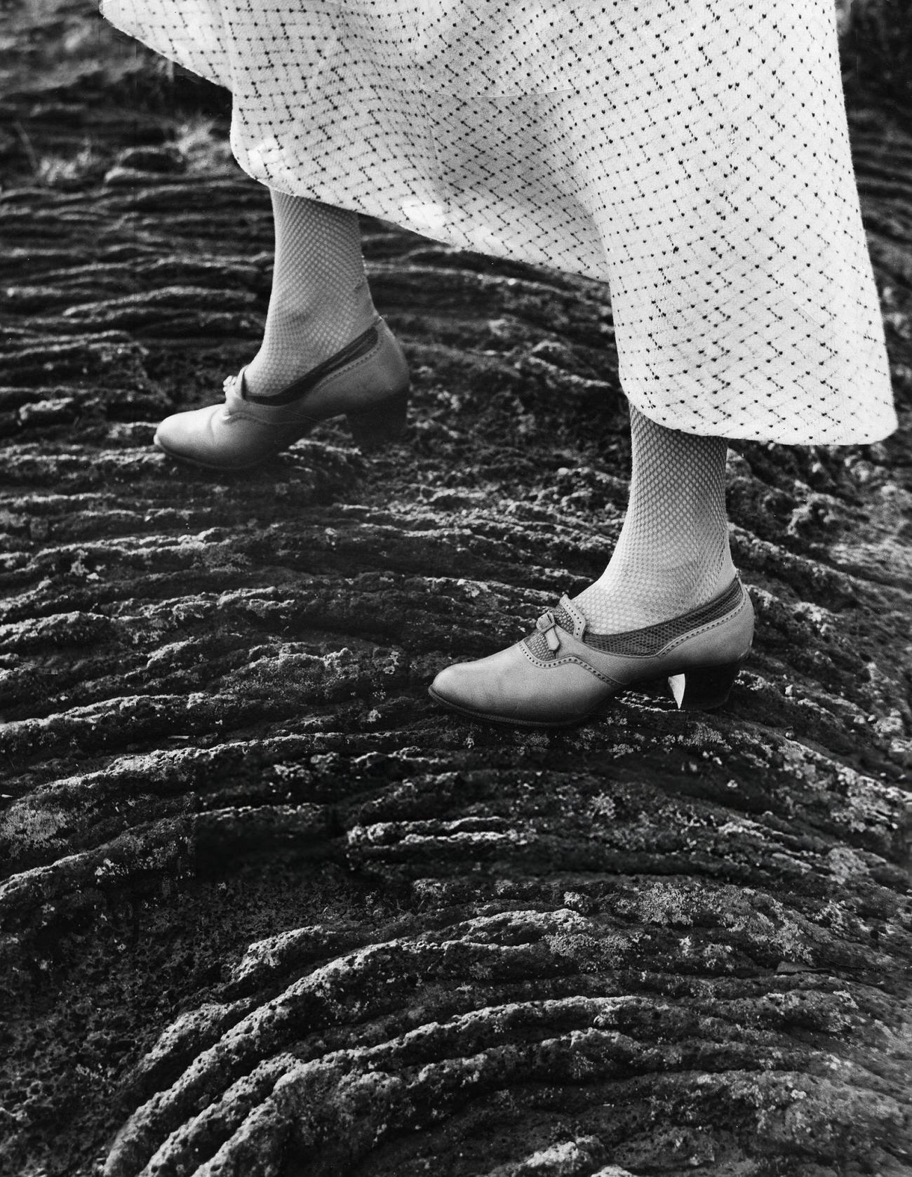 A woman walking on lava in Iceland, 1935.