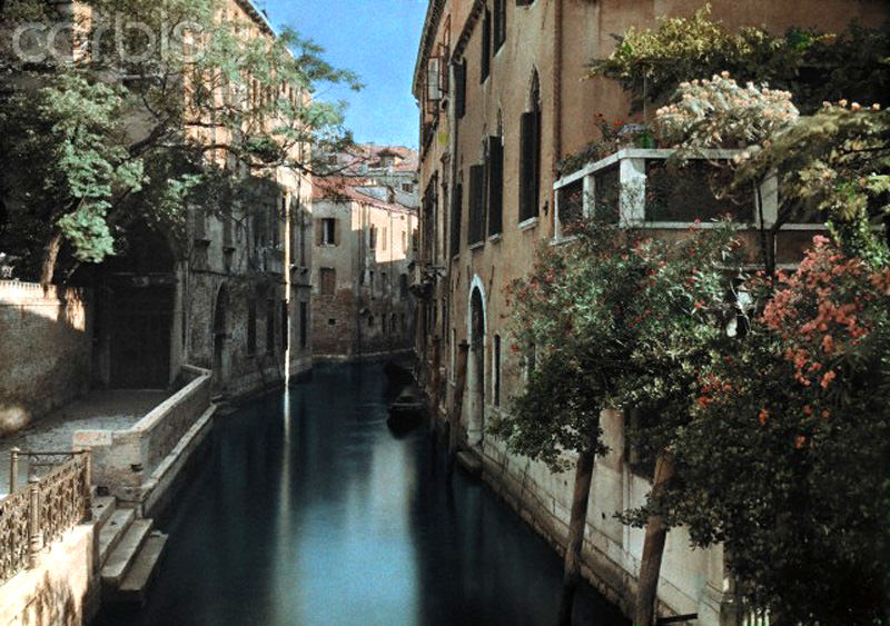 A view of a picturesque canal in Venice, Italy, 1927.