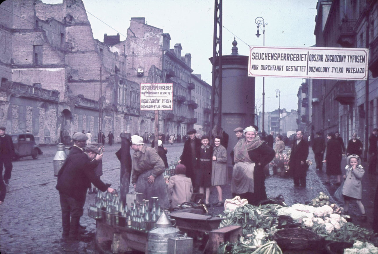 Warsaw, Nazi-occupied Poland, 1940. The signs read, "Typhus area. Passage permitted only while traveling."