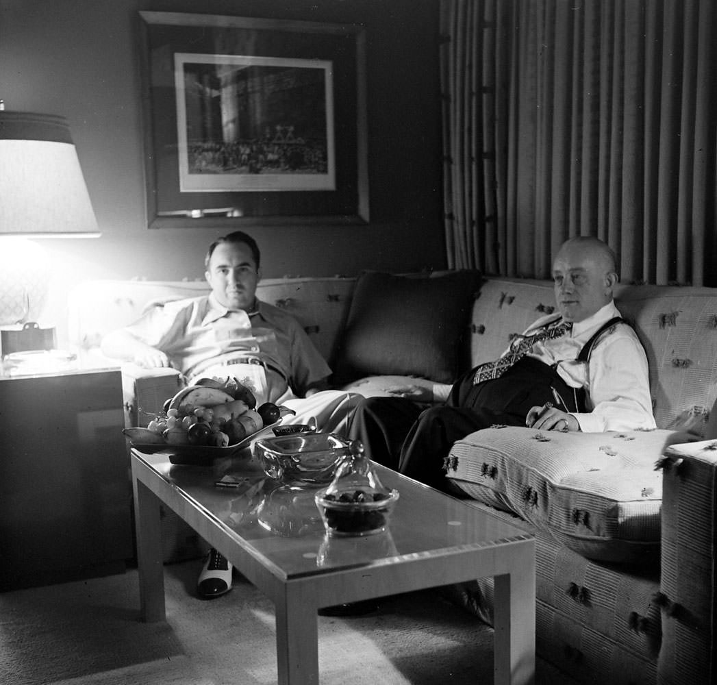 Mickey Cohen at home in Los Angeles with his business manager, Mike Howard, 1949.