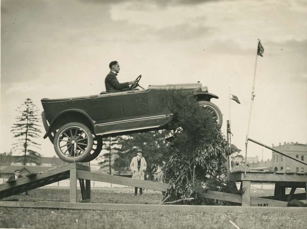 Overland car jumping a fallen bridge in a promotional stunt, 1920 - 1929