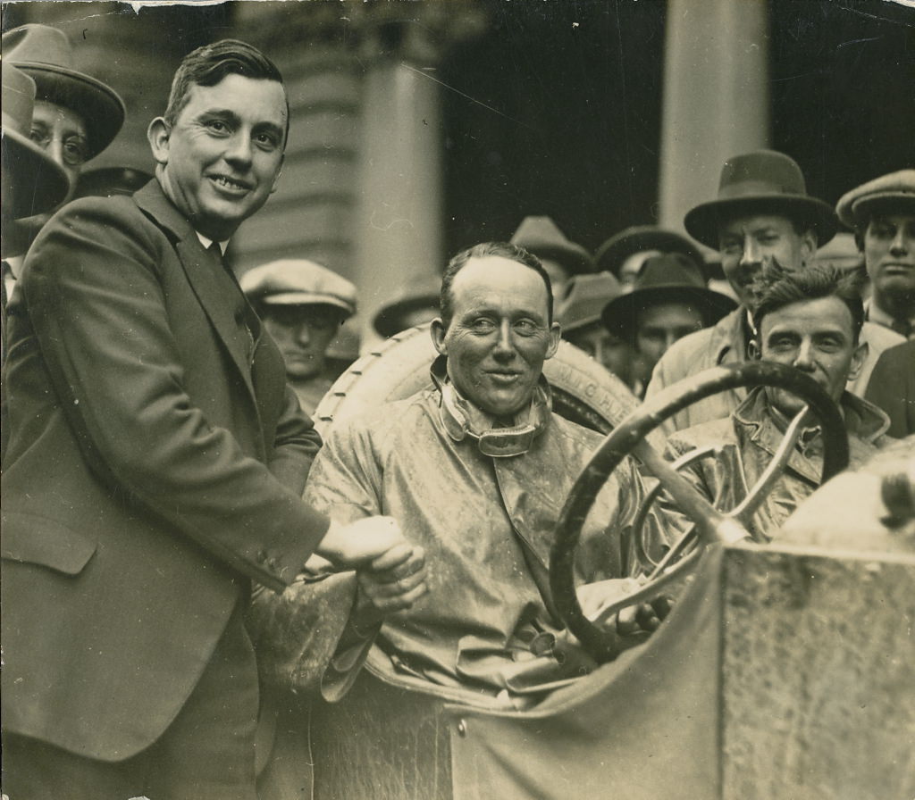 Dave Carrigan at wheel of a Willys Knight car, 1926