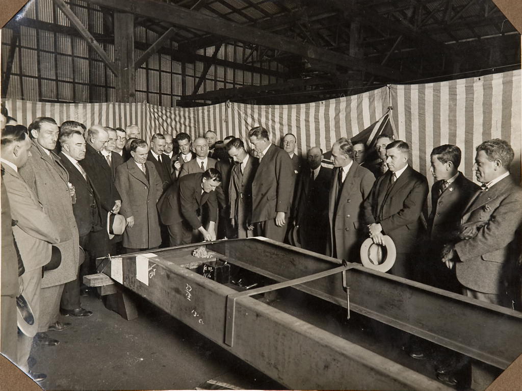 Men inspecting the frame of the car F.H. Stewart Enterprise, 1926 - 1936